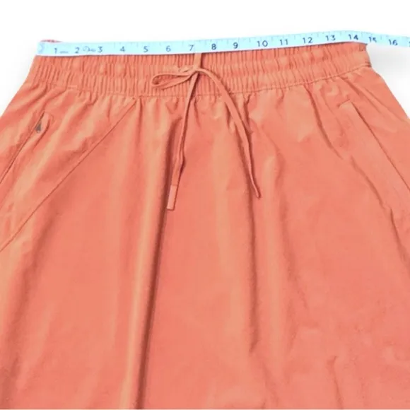Athleta Arrival Pull-on Skirt Sunbaked Clay Red Orange Zip Pocket Women’s Sz 10